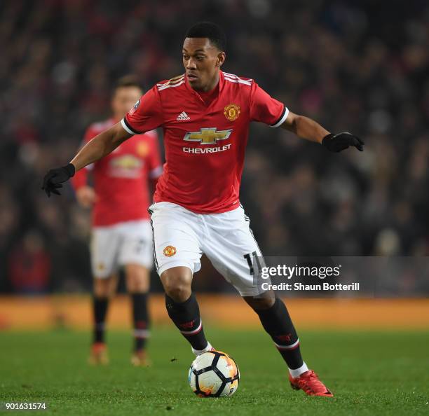 Anthony Martial of Manchester United runs with the ball during the Emirates FA Cup Third Round match between Manchester United and Derby County at...