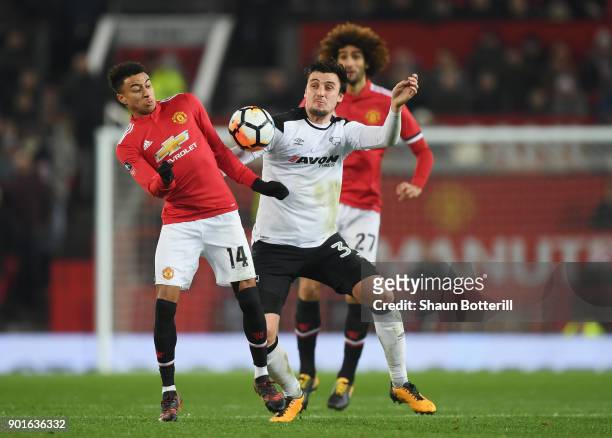 George Thorne of Derby County battles with Jesse Lingard of Manchester United during the Emirates FA Cup Third Round match between Manchester United...
