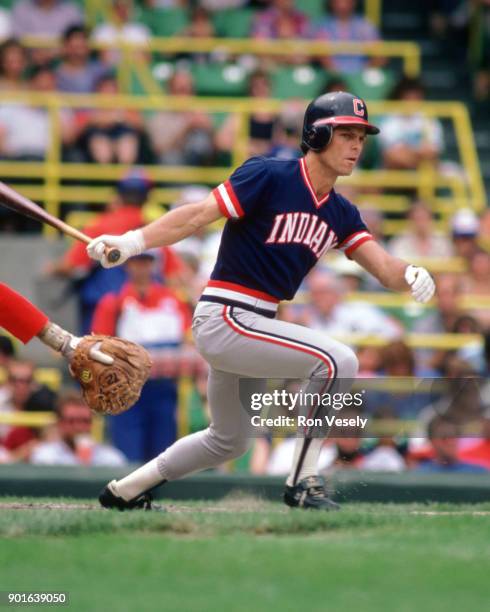 Brett Butler of the Cleveland Indians runs bats during an MLB game versus the Chicago White Sox at Comiskey Park in Chicago, Illinois during the 1986...