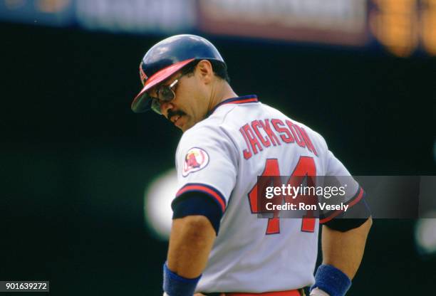 Reggie Jackson of the California Angels looks on during an MLB game versus the Chicago White Sox at Comiskey Park in Chicago, Illinois during the...