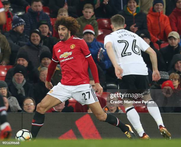 Marouane Fellaini of Manchester United in action with Jamie Hanson of Derby County during the Emirates FA Cup Third Round match between Manchester...