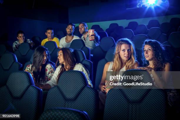 people watching a movie in a cinema - cineplex cinema stock pictures, royalty-free photos & images