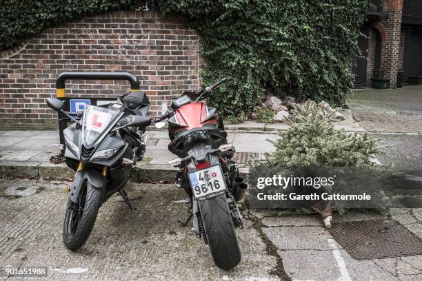 Discarded Christmas tree lies in a street in Angel on January 5, 2018 in London, England. In the lead up to Christmas a pine tree is the centre point...