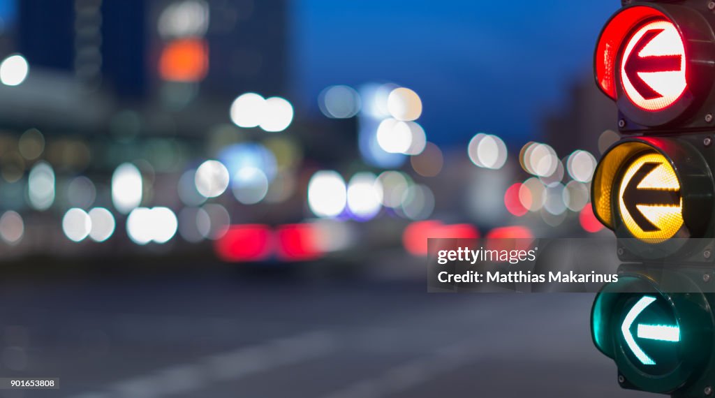 Urban City Street Szene with colorful Traffic Lights and Bokeh Night Lights