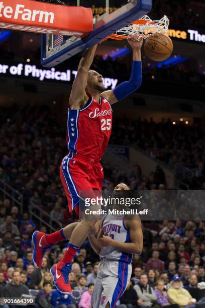 Ben Simmons of the Philadelphia 76ers dunks the ball past Avery Bradley of the Detroit Pistons in the second quarter at the Wells Fargo Center on...