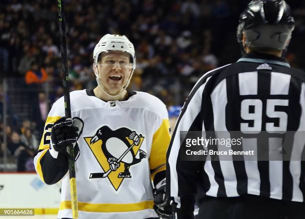 Patric Hornqvist of the Pittsburgh Penguins argues with linesman Jonny Murray during the second period at the Barclays Center on January 5, 2018 in...