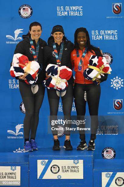 Heather Bergsma, Brittany Bowe and Erin Jackson stand on the podium following the Ladies 500 meter event during the Long Track Speed Skating Olympic...