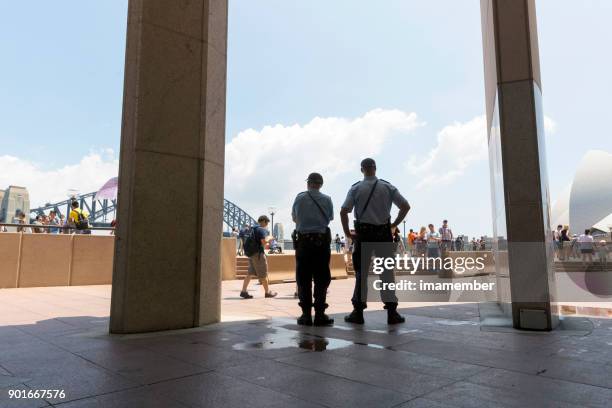 police officers patrol the street in sydney, copy space - boardwalk australia stock pictures, royalty-free photos & images