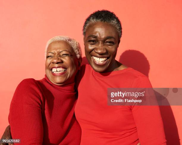 portrait of two women smiling - woman studio shot stock pictures, royalty-free photos & images