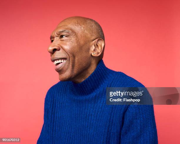 portrait of mature man smiling - aged man portrait studio stock-fotos und bilder