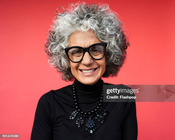 portrait of mature woman laughing - necklace stock pictures, royalty-free photos & images