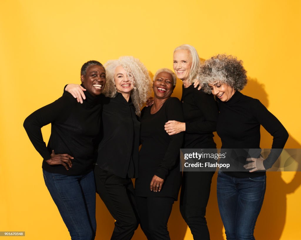 Portrait of five women laughing and having fun