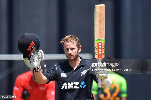 New Zealand's captain Kane Williamson celebrates his century during the first one day international cricket match between New Zealand and Pakistan at...