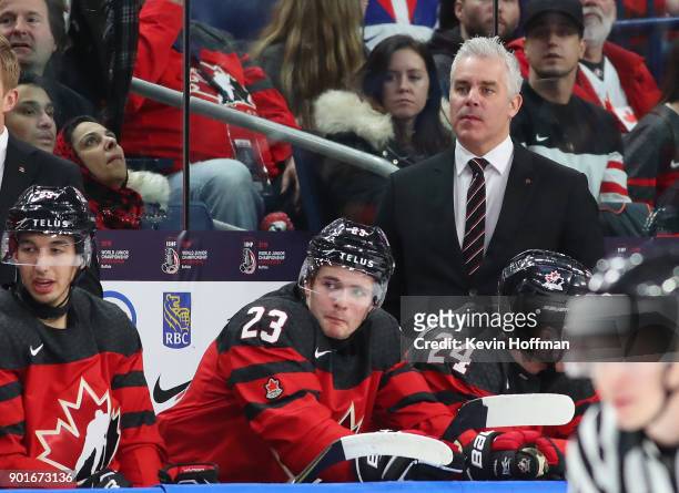 Head coach Dominique Ducharme of Canada watches play during the Gold medal game against Sweden of the IIHF World Junior Championship at KeyBank...