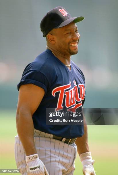 Kirby Puckett of the Minnesota Twins looks on during an MLB game against the Milwaukee Brewers at County Stadium in Milwaukee, Wisconsin during the...