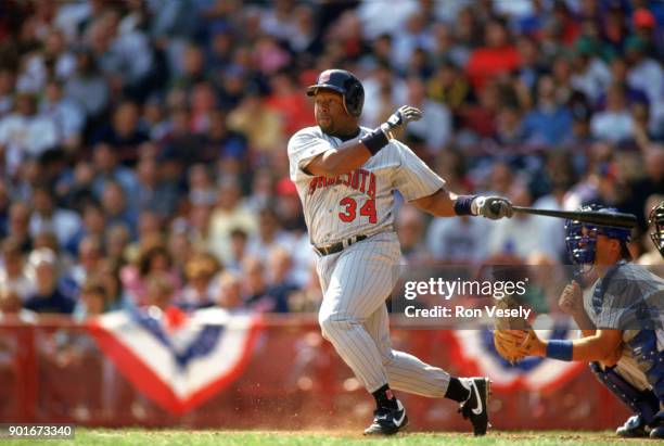 Kirby Puckett of the Minnesota Twins bats during an MLB game against the Milwaukee Brewers at County Stadium in Milwaukee, Wisconsin during the 1988...