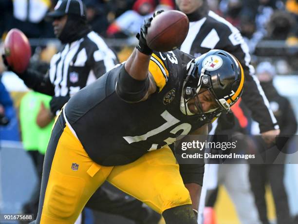 Left guard Ramon Foster of the Pittsburgh Steelers spikes the ball after a rushing touchdown by running back Stevan Ridley in the second quarter of a...