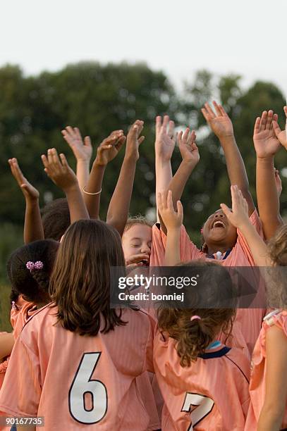 team spirit - softball sport stock pictures, royalty-free photos & images