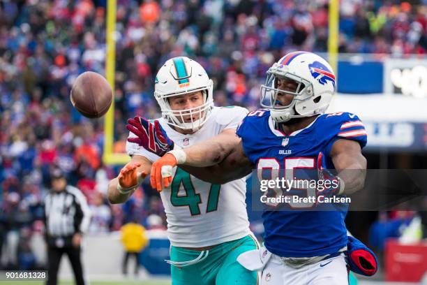 Kiko Alonso of the Miami Dolphins breaks up a pass intended for Charles Clay of the Buffalo Bills during the second half at New Era Field on December...