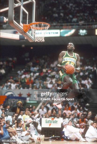 Shawn Kemp of the Seattle Supersonics competes in the slam dunk contest during NBA All Star Weekend on February 10, 1990 at the Miami Arena in Miami,...