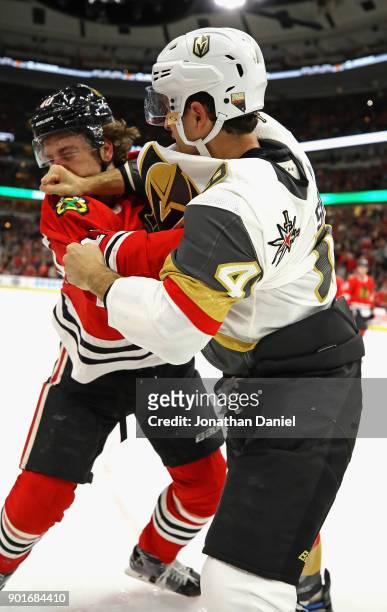 Luca Sbisa of the Vegas Golden Knights and John Hayden of the Chicago Blackhawks fight in the second period at the United Center on January 5, 2018...