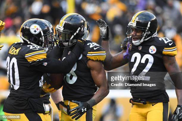 Safety Sean Davis of the Pittsburgh Steelers celebrates intercepting a pass with safety Robert Golden and cornerback William Gay, in the fourth...