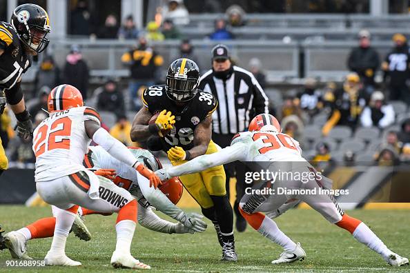 Steven Ridley Ripped Running back Stevan Ridley of the Pittsburgh Steelers is tackled by ...