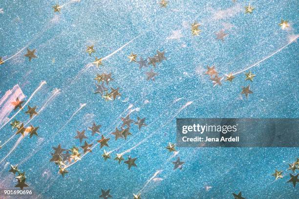 star confetti star shaped confetti - blue glitter stars stock pictures, royalty-free photos & images
