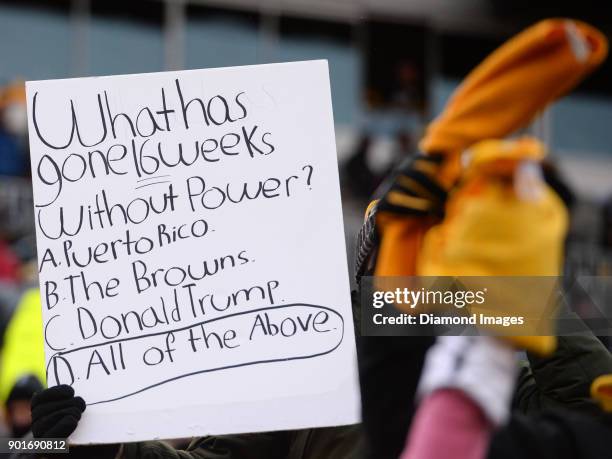 Fan of the Pittsburgh Steelers holds up a sign in the fourth quarter of a game on December 31, 2017 against the Cleveland Browns at Heinz Field in...