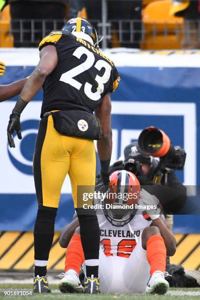 Safety Mike Mitchell of the Pittsburgh Steelers offers a hand to wide receiver Corey Coleman of the Cleveland Browns in the fourth quarter of a game...