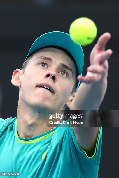 Alex de Minaur of Australia serves in his semi final match against Ryan Harrison of USA during day seven of the 2018 Brisbane International at Pat...