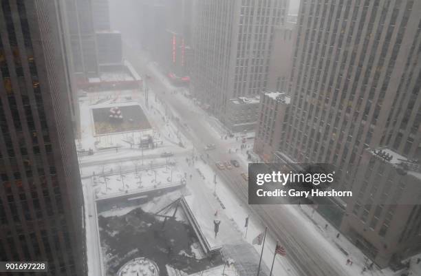 Winter storm called a "bomb cyclone" dumps snow on 6th Avenue on January 4, 2018 in New York City.