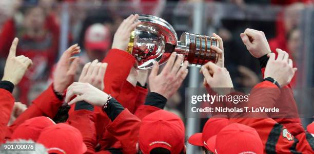 Members of Team Canada hoist the Championship trophy following their 3-1 win over Sweden in the IIHF World Junior Championships Gold Medal game at...