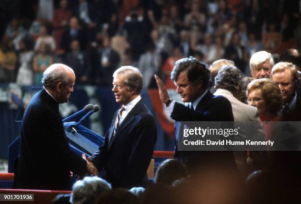 President Jimmy Carter is congratulated by Senator Robert Drinan and Presidential candidate Senator Ted Kennedy after giving a speech at the...