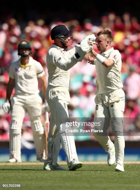 Mason Crane of England celebrates after taking the wicket of Usman Khawaja of Australia during day three of the Fifth Test match in the 2017/18 Ashes...