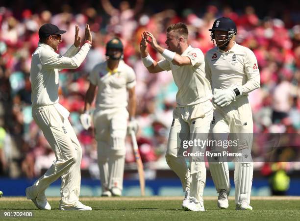 Mason Crane of England celebrates after taking the wicket of Usman Khawaja of Australia during day three of the Fifth Test match in the 2017/18 Ashes...