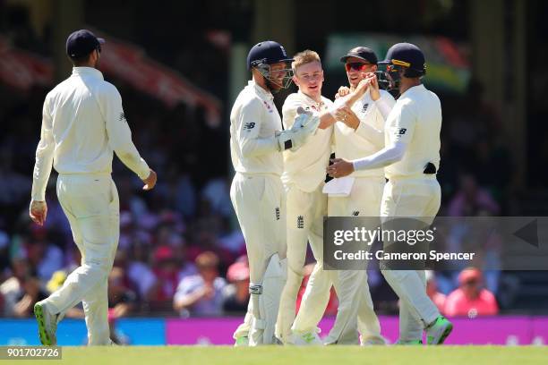 Mason Crane of England celebrates dismissing Usman Khawaja of Australia during day three of the Fifth Test match in the 2017/18 Ashes Series between...