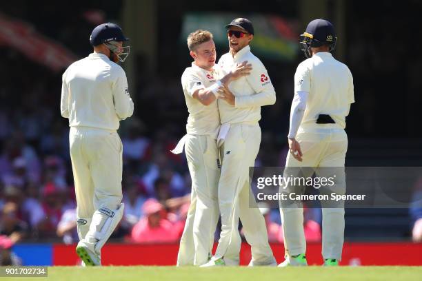 Mason Crane of England celebrates dismissing Usman Khawaja of Australia during day three of the Fifth Test match in the 2017/18 Ashes Series between...