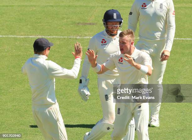 Mason Crane of England celebrates his first test wicket of Usman Khawaja of Australia during day three of the Fifth Test match in the 2017/18 Ashes...