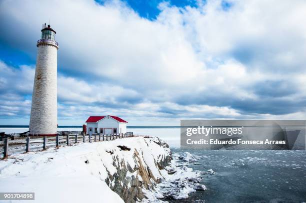 white landscapes - cap-des-rosiers lighthouse inside the forillon national park - forillon national park stock pictures, royalty-free photos & images