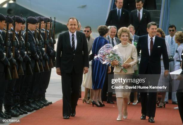 Foreign Minister Hans-Dietrich Genscher, First Lady Nancy Reagan and President Ronald Reagan arrive in Bonn West, Germany. Alexander Haig in rear...