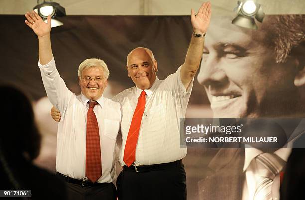 German Foreign Minister and vice-chancellor Frank-Walter Steinmeier waves with his party's candidate in Saxony, Thomas Jurk, during an election rally...