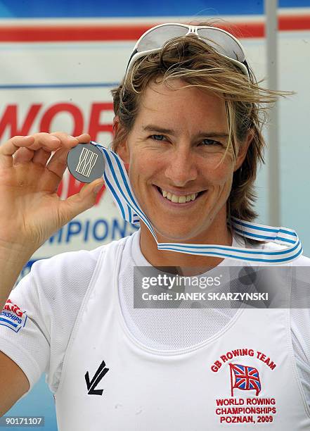 British Katherine Grainger poses with her silver medals after the final women's single sculls competition of the World Rowing Championships on August...