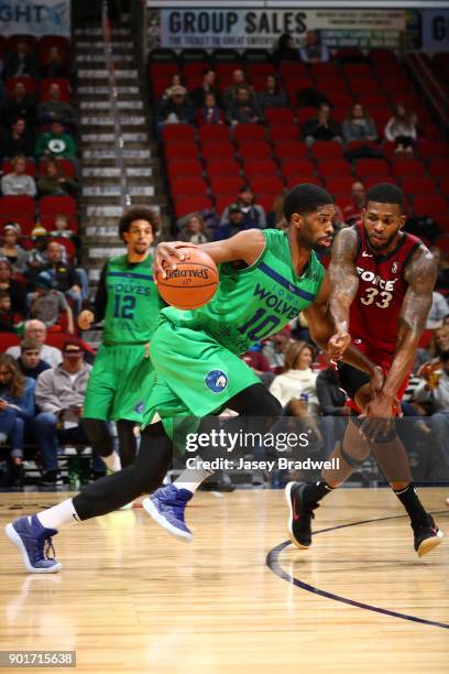 Amile Jefferson of the Iowa Wolves drives around Alonzo Gee of the Sioux Falls Skyforce in an NBA G-League game on January 5, 2018 at the Wells Fargo...