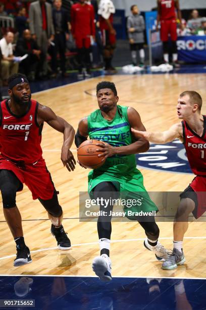 Wes Washpun of the Iowa Wolves drives into the paint past Ike Nwamu of the Sioux Falls Skyforce in an NBA G-League game on January 5, 2018 at the...