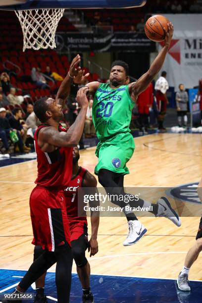 Wes Washpun of the Iowa Wolves goes up for a shot against Ike Nwamu of the Sioux Falls Skyforce in an NBA G-League game on January 5, 2018 at the...
