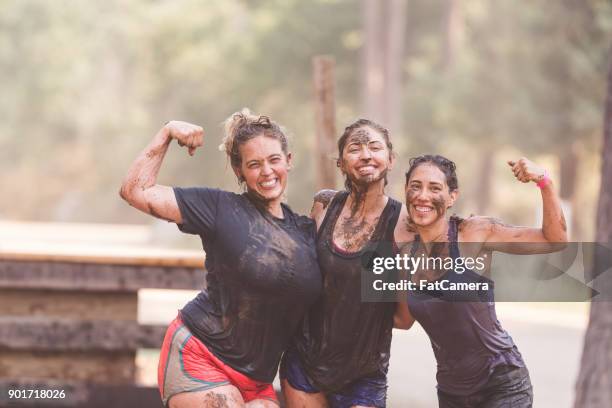 mud run fundraiser! - dirty women pics stock pictures, royalty-free photos & images