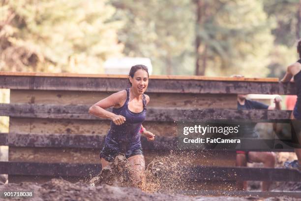 mud run fundraiser! - swimwear singlet stock pictures, royalty-free photos & images