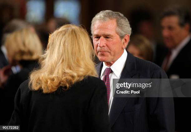 Former U.S. President George W. Bush talks with U.S. Senator Edward Kennedy's ex-wife Joan Kennedy during funeral services for Sen. Kennedy at the...