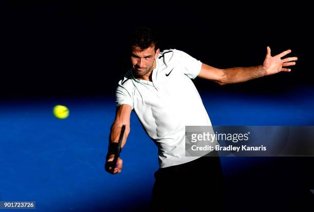 Grigor Dimitrov of Bulgaria plays a backhand in his semi final match against Nick Kyrgios of Australia during day seven of the 2018 Brisbane...